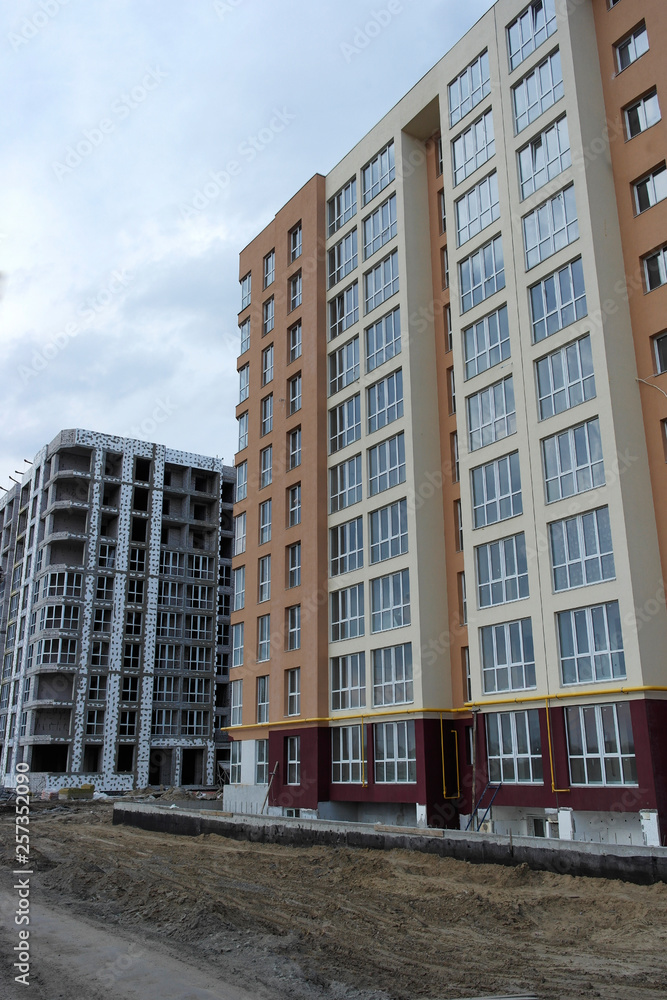 construction of a multi-storey building next to a built house