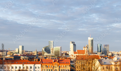 Sunset view of Downtown Financial District in Vilnius, Lithuania. Cloudy sky background and old town foreground.