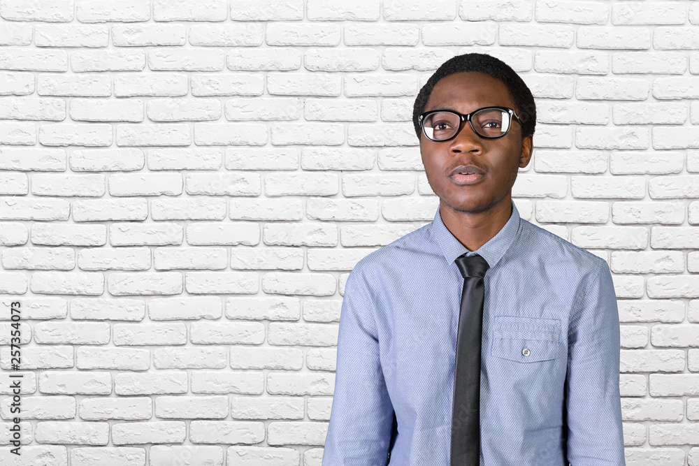 Portrait of happy young african guy with his arms crossed Portrait of happy young african guy with his arms crossed