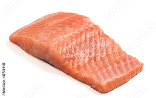 Raw salmon fillet on a white background. Trout fillet with rosemary. Wild atlantic fish