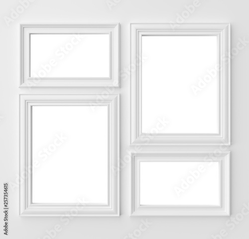 White frames for photo on white wall with copy-space