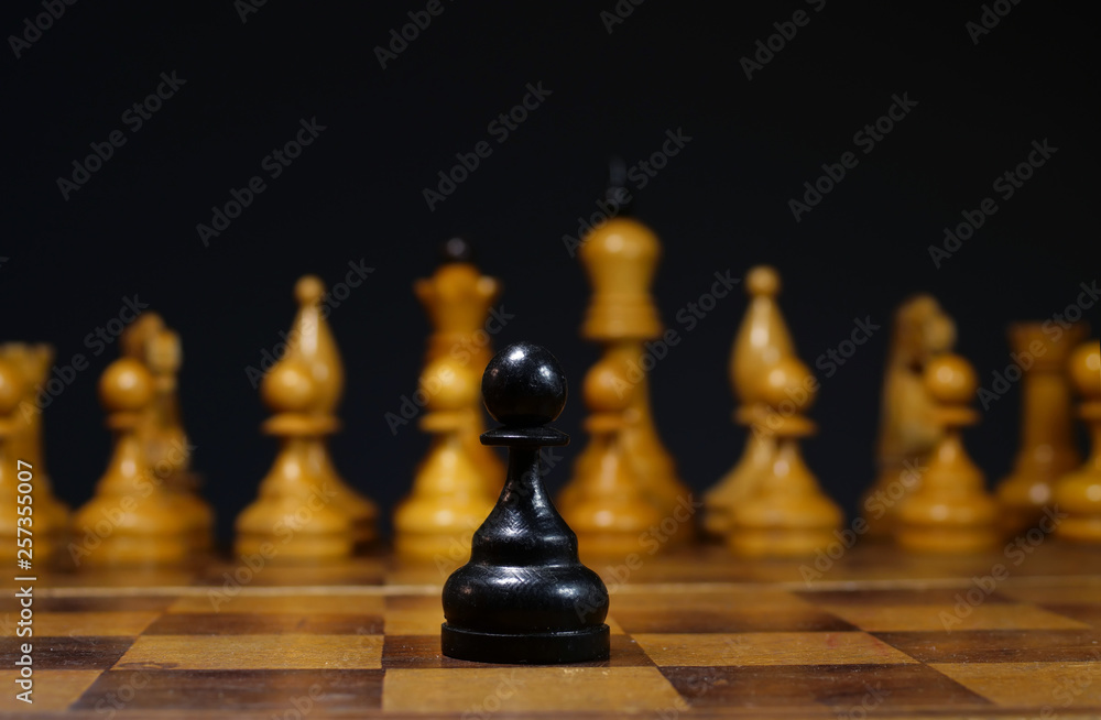 Bravery and leadership. Difficult decision in business. Pawn on a desk. Bravery and leadership. Difficult decision in business. Pawn on a desk.