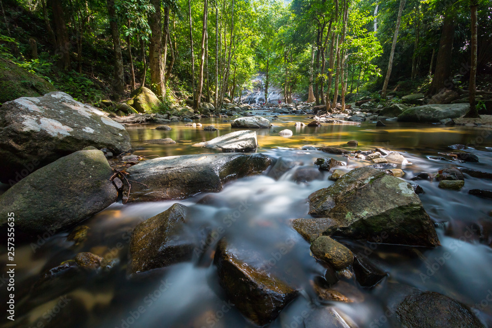 Long exposure shot.Waterfall with rocks in rainforest. Long exposure shot.Waterfall with rocks in rainforest.