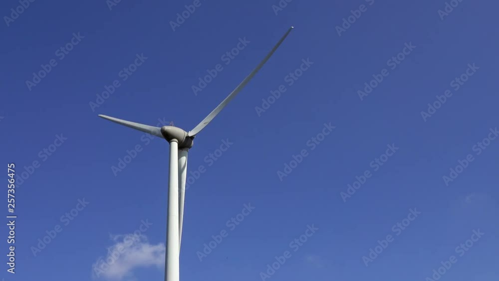 Windmill or wind turbine on wind farm in rotation to generate electricity energy, 4k Windmill or wind turbine on wind farm in rotation to generate electricity energy, 4k