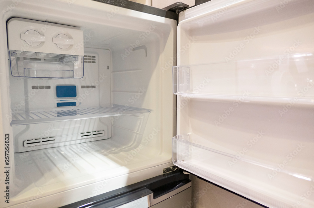 open empty new white refrigerator inside fridge with shelves . open empty new white refrigerator inside fridge with shelves .