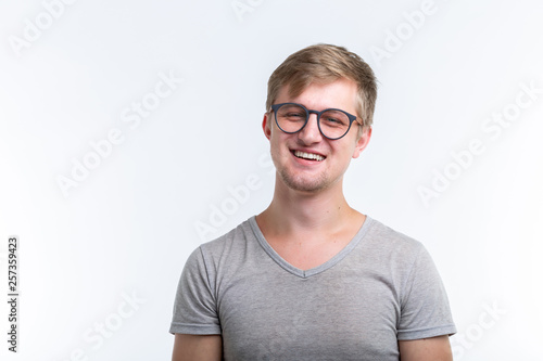 Geek, education, people concept - young man over the white background looks like he is a nerd © satura_
