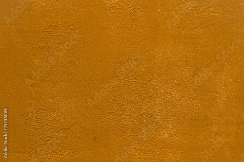 orange vintage plaster with damaged paint texture - pretty abstract photo background