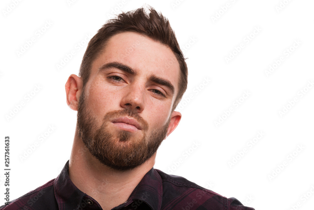 Close up of a handsome bearded man looking to the camera confidently. Sexy attractive man posing fiercely isolated, copy space. Confident man looking aggressively at you. Masculinity, danger concept Close up of a handsome bearded man looking to the camera confidently. Sexy attractive man posing fiercely isolated, copy space. Confident man looking aggressively at you. Masculinity, danger concept
