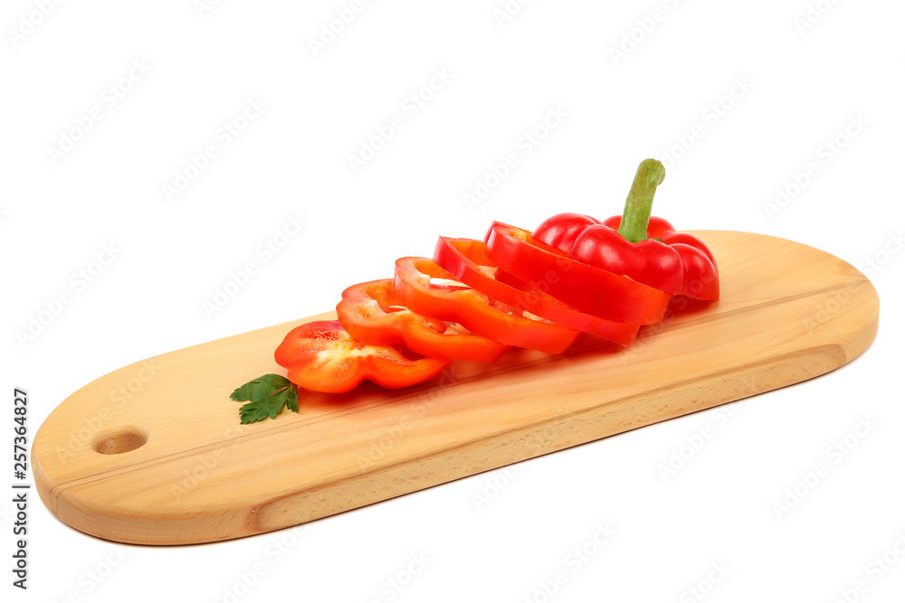 Slices of sweet pepper on a cutting wooden board. Slices of sweet pepper on a cutting wooden board.