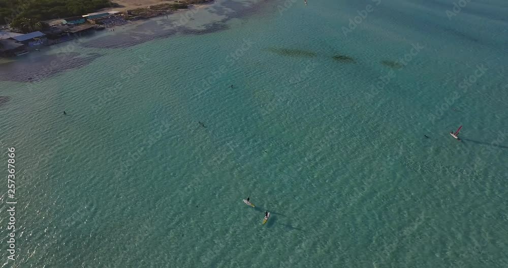 People stand up paddling in Lac Bay, Bonaire. Aerial shot. People stand up paddling in Lac Bay, Bonaire. Aerial shot.