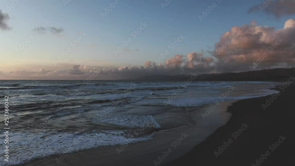 Blazing colors of sunset beach, rhythmically beaten by Pacific Ocean Waves. Natural golden saturation. Drone based aerial footage. Cinematic and beautiful. calming and Relaxed Euphoric camping Blazing colors of sunset beach, rhythmically beaten by Pacific Ocean Waves. Natural golden saturation. Drone based aerial footage. Cinematic and beautiful. calming and Relaxed Euphoric camping