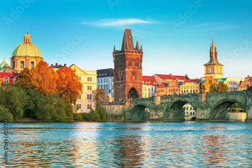 Scenic view on Vltava rive, Charles bridge and historical center of Prague, buildings and landmarks of old town at sunset, Prague, Czech Republic