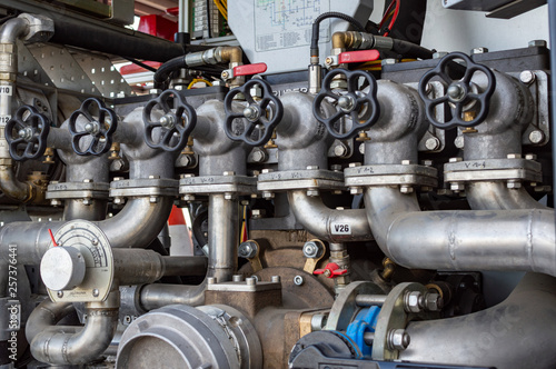 Close up on mechanics of a fire truck. Industrial, valves, mechanics.