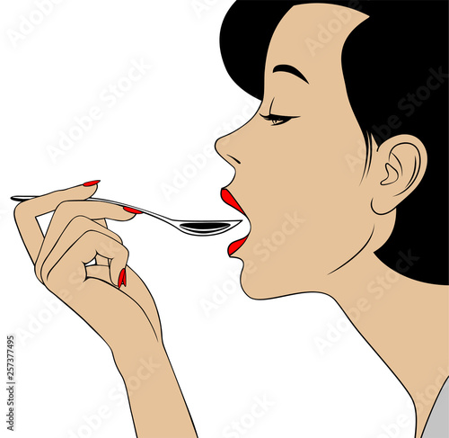 Woman in profile with open mouth holding a spoon in her hand