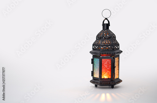 Arabic lantern with burning candle photo