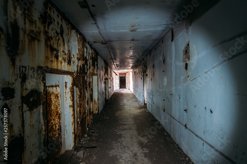 Dark horror creepy corridor or tunnel with light in end in abandoned rusted nuclear power plant in Crimea