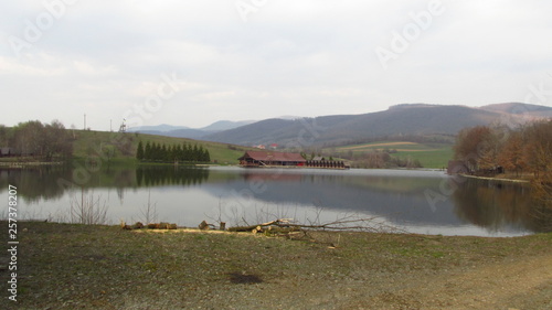 Fototapeta Naklejka Na Ścianę i Meble -  beautbeautiful lake among small mountainsiful lake among small mountains