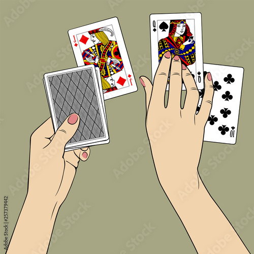 Female hands laying out the playing cards.