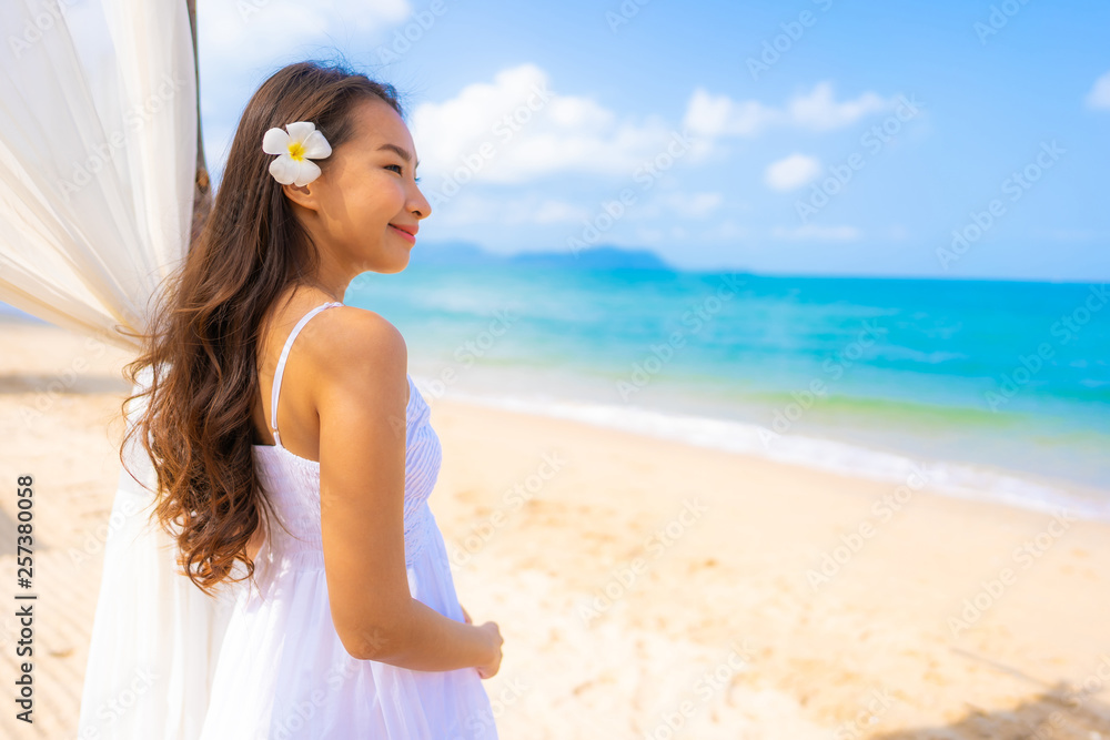 Portrait beautiful young asian woman happy smile leisure on the beach sea and ocean Portrait beautiful young asian woman happy smile leisure on the beach sea and ocean