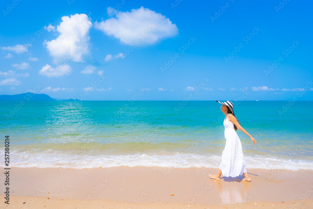 Portrait beautiful young asian woman happy smile leisure on the beach sea and ocean