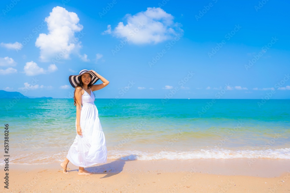 Portrait beautiful young asian woman happy smile leisure on the beach sea and ocean Portrait beautiful young asian woman happy smile leisure on the beach sea and ocean