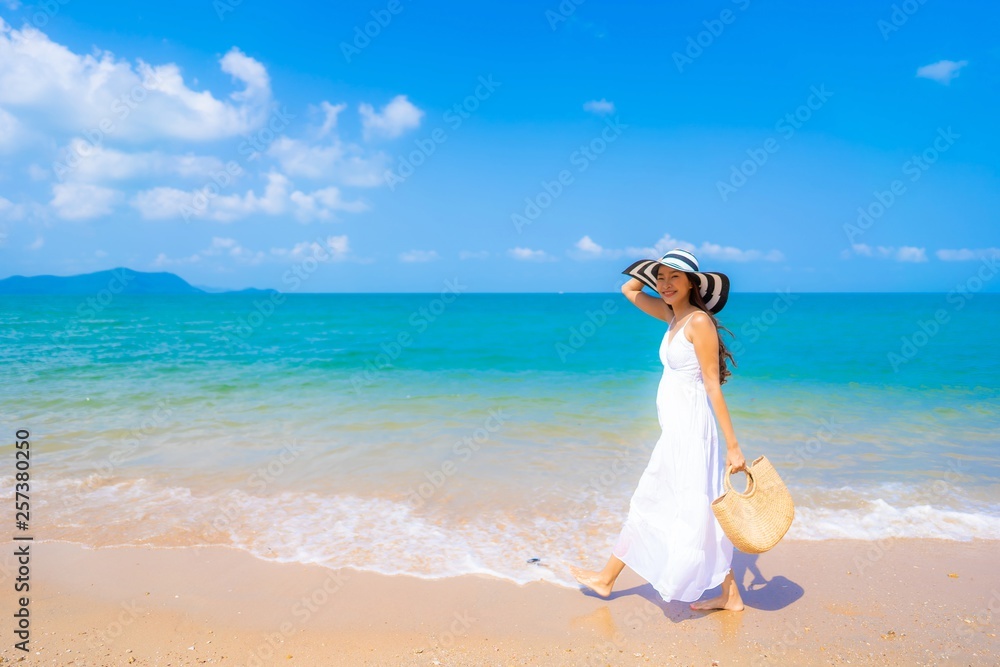 Portrait beautiful young asian woman happy smile leisure on the beach sea and ocean Portrait beautiful young asian woman happy smile leisure on the beach sea and ocean