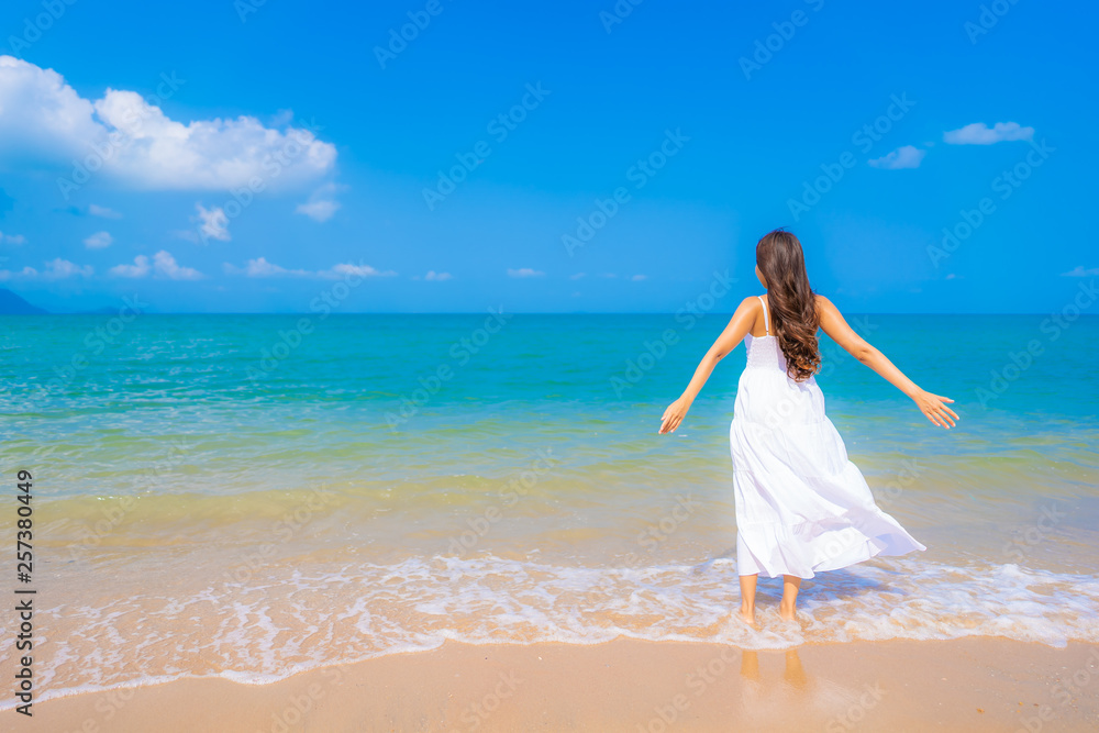 Portrait beautiful young asian woman happy smile leisure on the beach sea and ocean Portrait beautiful young asian woman happy smile leisure on the beach sea and ocean