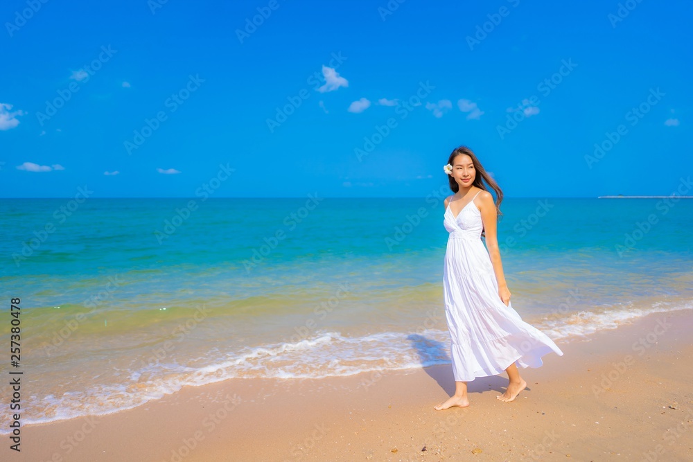 Portrait beautiful young asian woman happy smile leisure on the beach sea and ocean Portrait beautiful young asian woman happy smile leisure on the beach sea and ocean