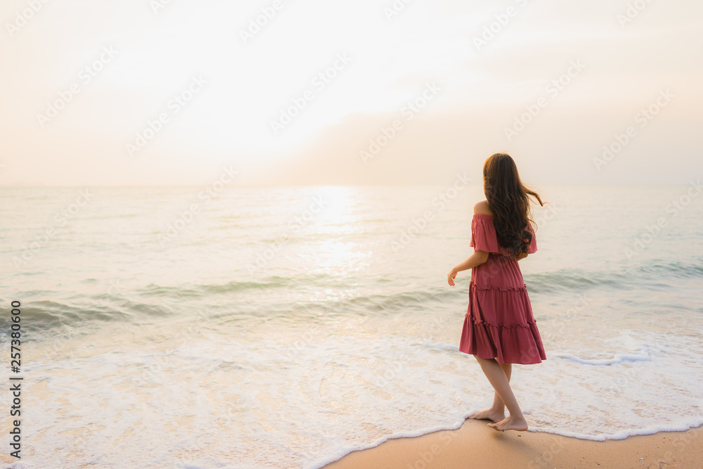 Portrait beautiful young asian woman happy smile leisure on the beach sea and ocean Portrait beautiful young asian woman happy smile leisure on the beach sea and ocean