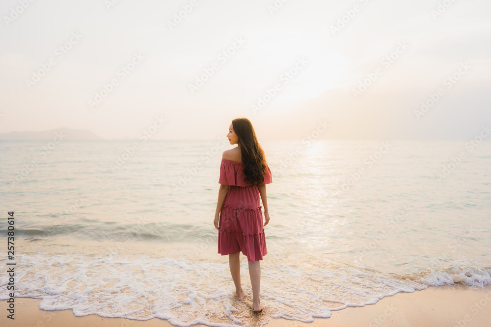 Portrait beautiful young asian woman happy smile leisure on the beach sea and ocean Portrait beautiful young asian woman happy smile leisure on the beach sea and ocean