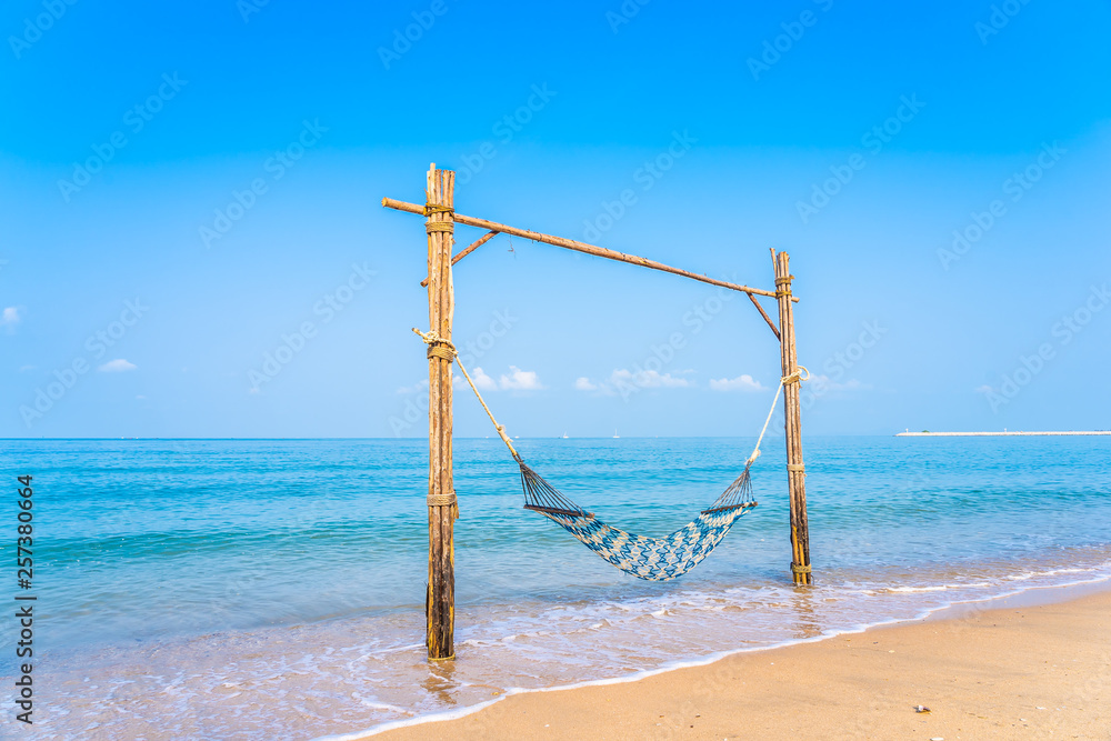 Empty hammock swing on the beautiful beach and sea Empty hammock swing on the beautiful beach and sea