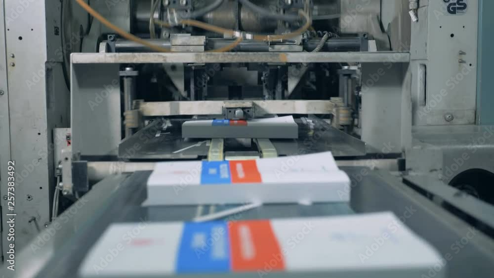 Newly-printed books are getting released by the industrial mechanism Newly-printed books are getting released by the industrial mechanism