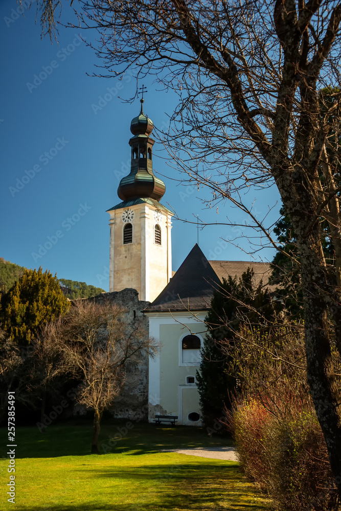 Naklejka premium View of Gloggnitz Castle in the Vienna Alps high above the Village Gloggnitz near the mountains Schneeberg and Rax