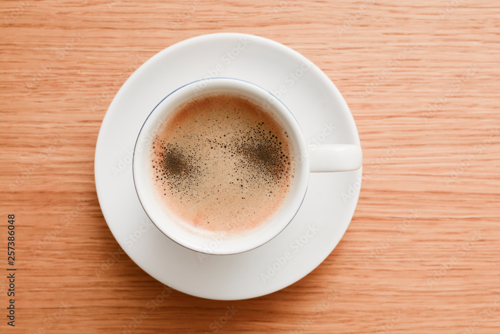 Espresso in a white cup on wooden table Espresso in a white cup on wooden table