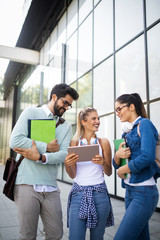 Happy group of students studying and learning together in college
