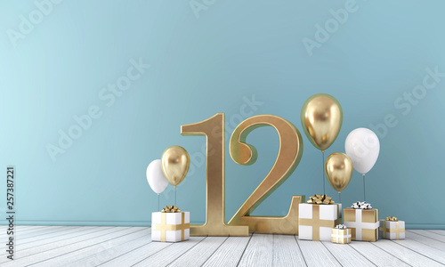 Number 12 party celebration room with gold and white balloons and gift boxes.  photo