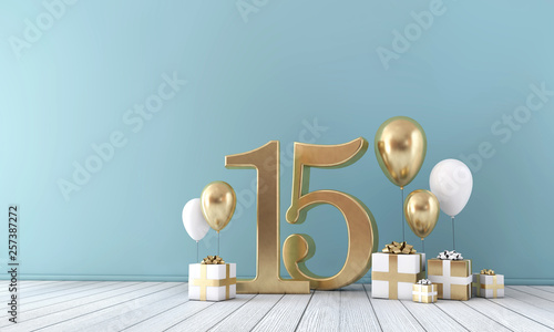 Number 15 party celebration room with gold and white balloons and gift boxes. 