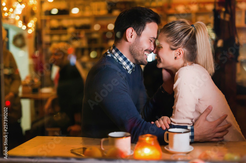 Young attractive couple on date in bar