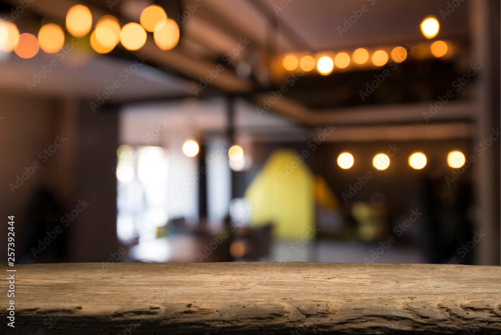 blurred background of bar and dark brown desk space of retro wood blurred background of bar and dark brown desk space of retro wood