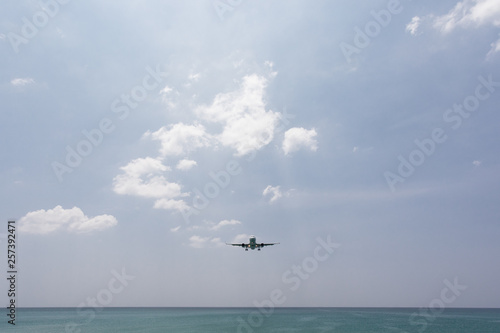 Airplane Landing over sea at Phuket Airport, Mai Khao beach phuket thailand