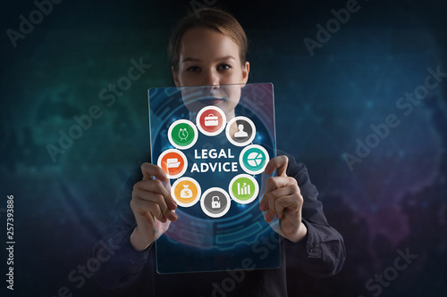 The concept of business, technology, the Internet and the network. A young entrepreneur working on a virtual screen of the future and sees the inscription: Legal advice © Egor