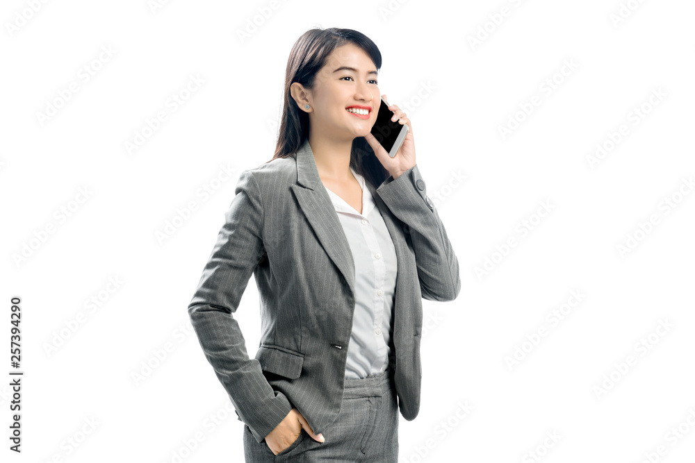Beautiful asian business woman talking on mobile phone Beautiful asian business woman talking on mobile phone