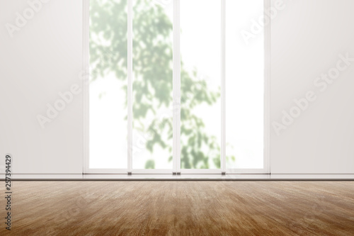 Interior room with wooden floor and white wall with window glass