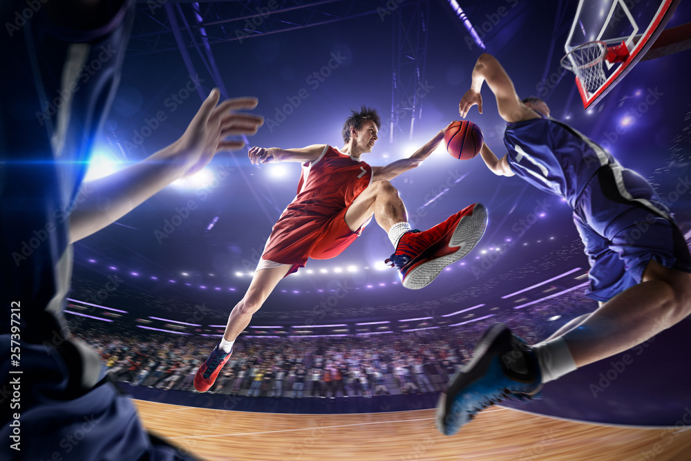 Basketball player make block shot in jump. around Arena with blue light ...