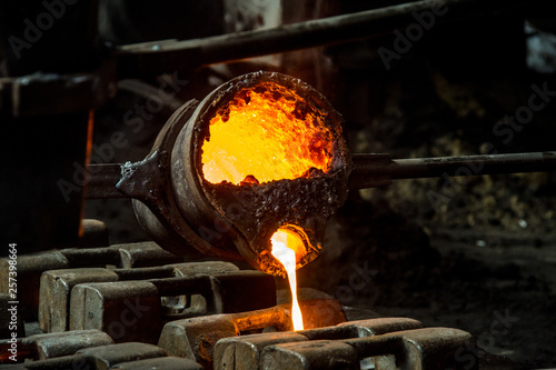 metal casting process with red high temperature fire in metal part factory