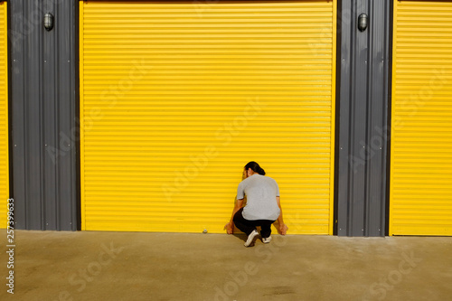 Man opening the shutter door