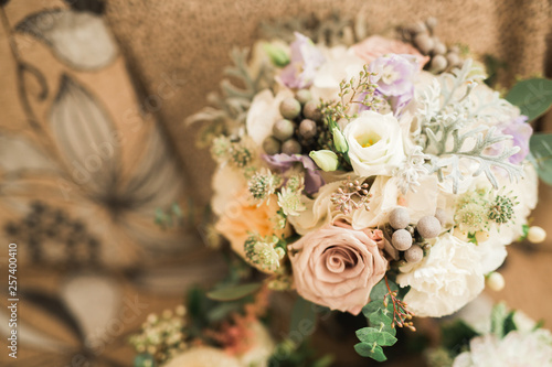 Beautiful wedding bouquet with different flowers, roses