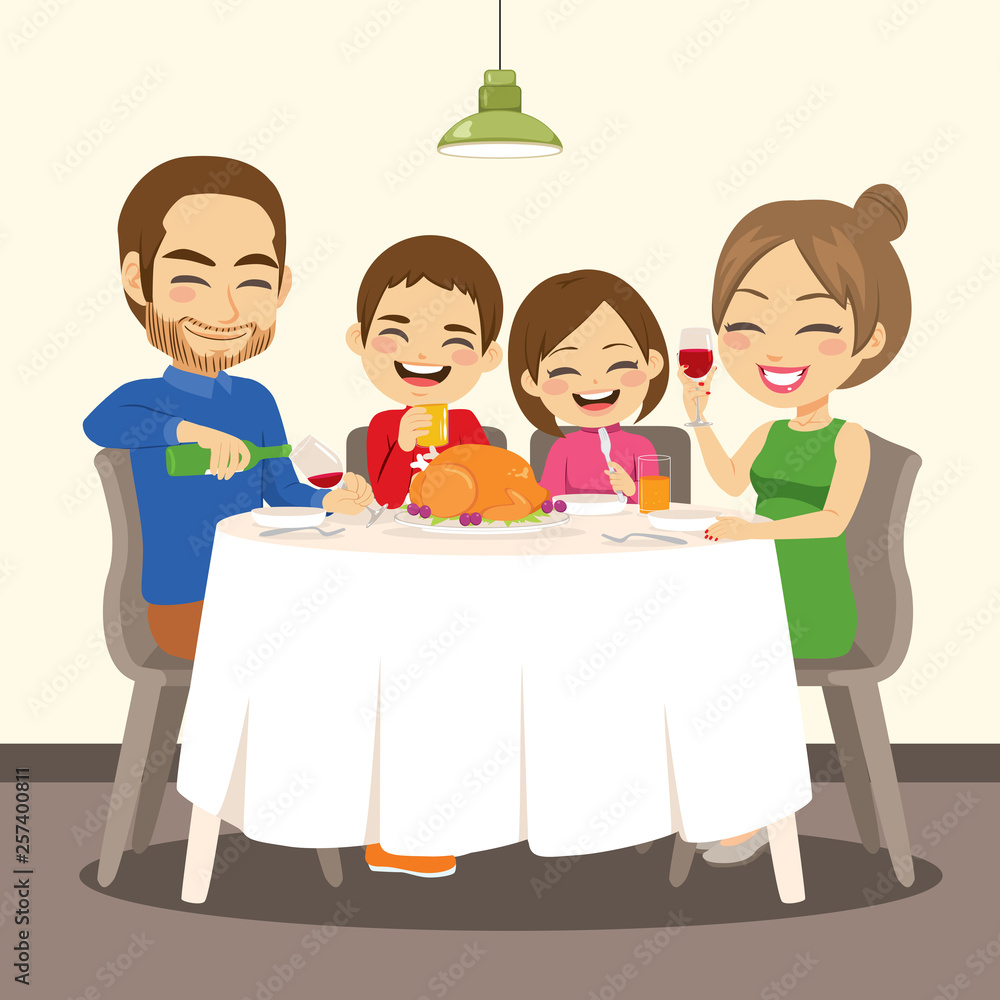 Happy family having dinner enjoying delicious roasted chicken sitting together on table Happy family having dinner enjoying delicious roasted chicken sitting together on table