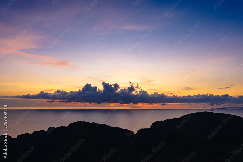 twilight seascape blue sky over colourful and silhouette mountain foreground at phi phi island Thailand