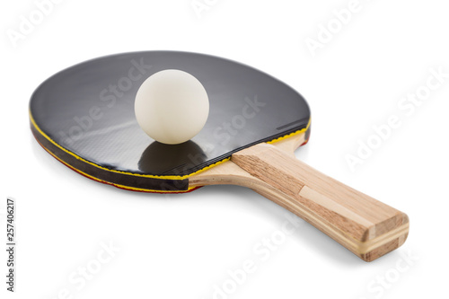 Ping pong paddle and ball isolated on white background with shadows. Selective sharpness.